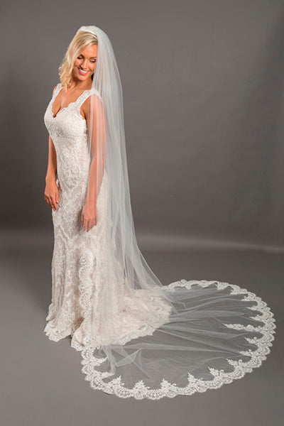 Cathedral length ivory veil with lace appliqued edge